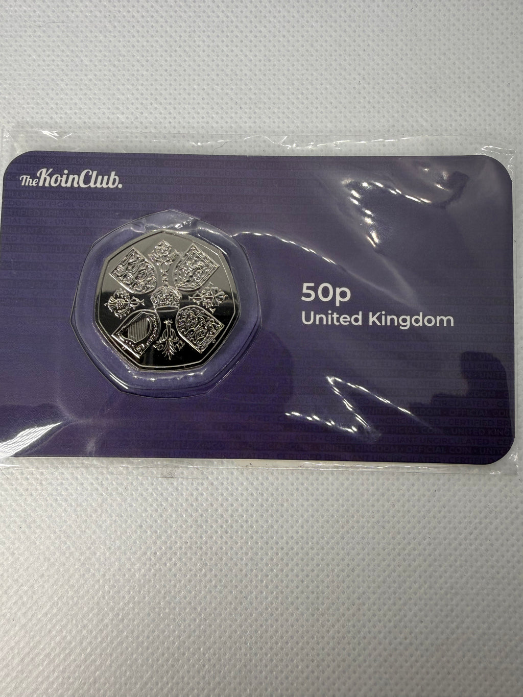 QEII Memorial 50p BU Coin, the first coin featuring King Charles, 2022.